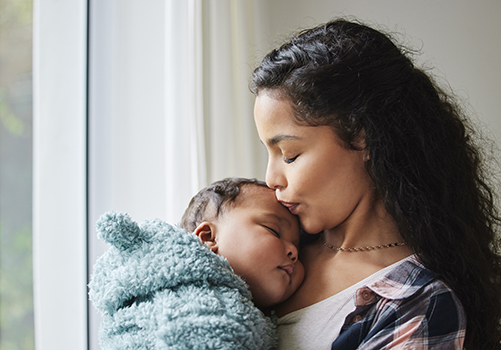 Mother Kissing Baby