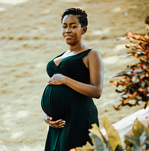 Pregnant woman in green dress